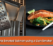 Smoked salmon on a gas grill: cedar-style salmon fillet alongside a Lion stainless steel smoker box with wood chips
