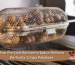 Small seasoned rotisserie basket potatoes tumbling evenly over the grates of a high-end grill setup