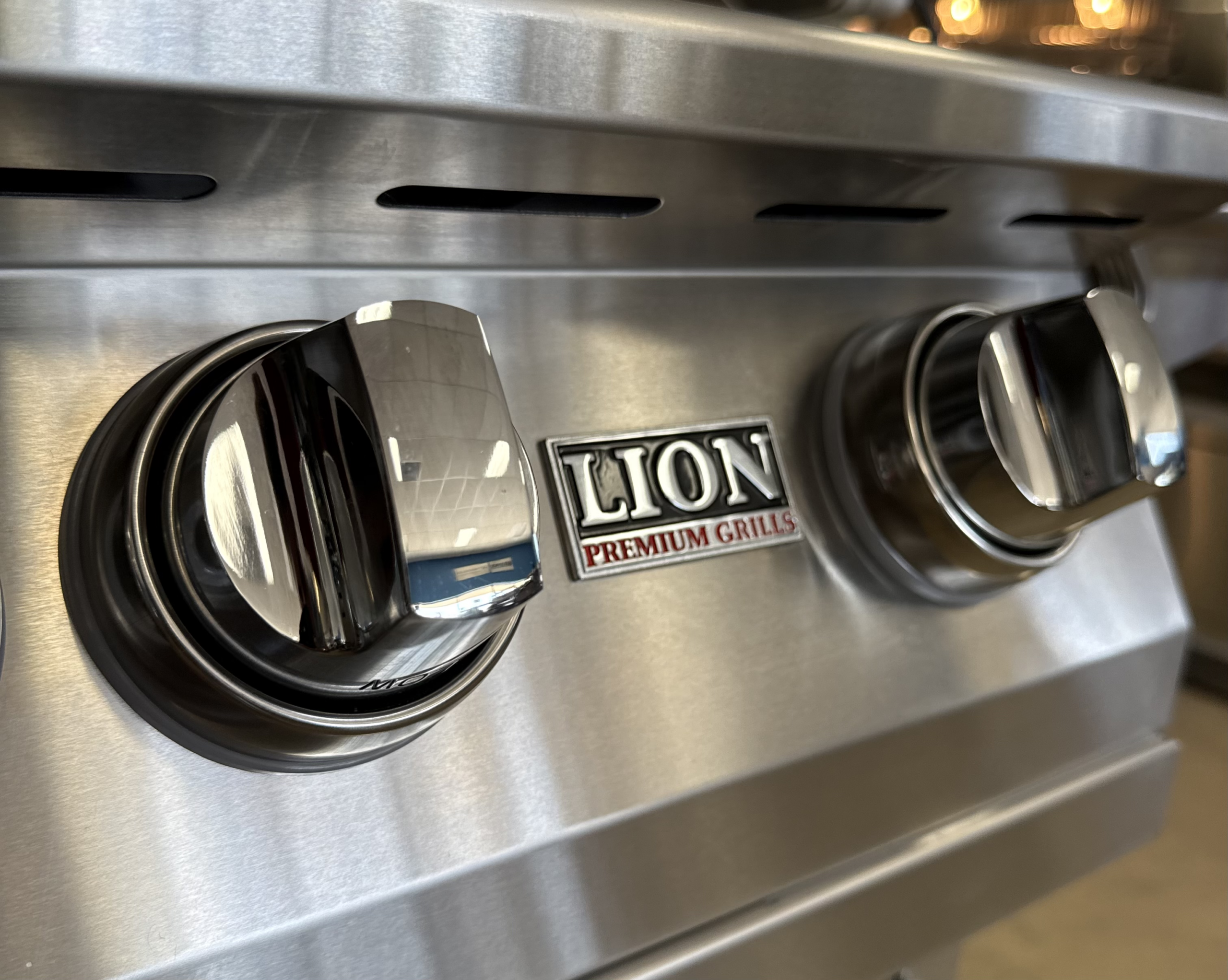 Lion Premium Grill burner controls for regulating temperatures during indirect smoking