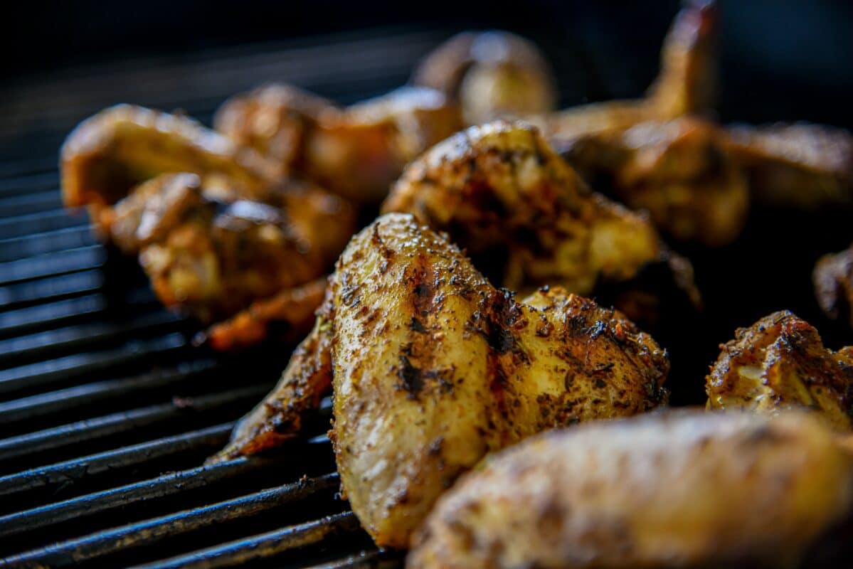 Smoked chicken wings cooked on a gas grill using a Lion smoker box