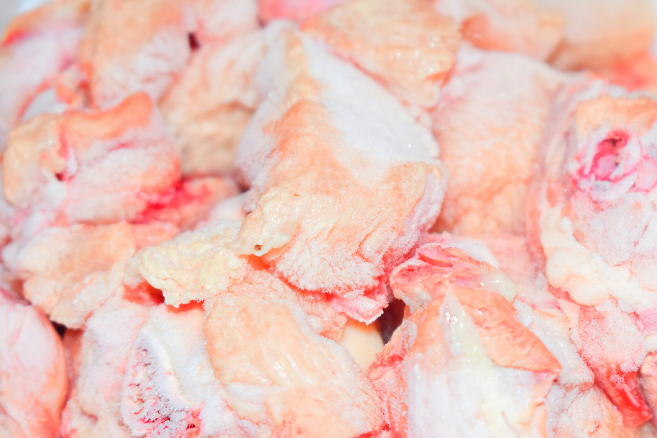 Raw chicken wings prepped with dry rub seasoning for the grill
